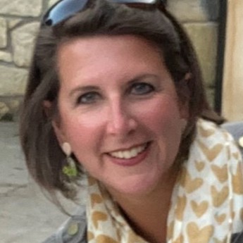 A woman with short brown hair, Dr Anna Sharman